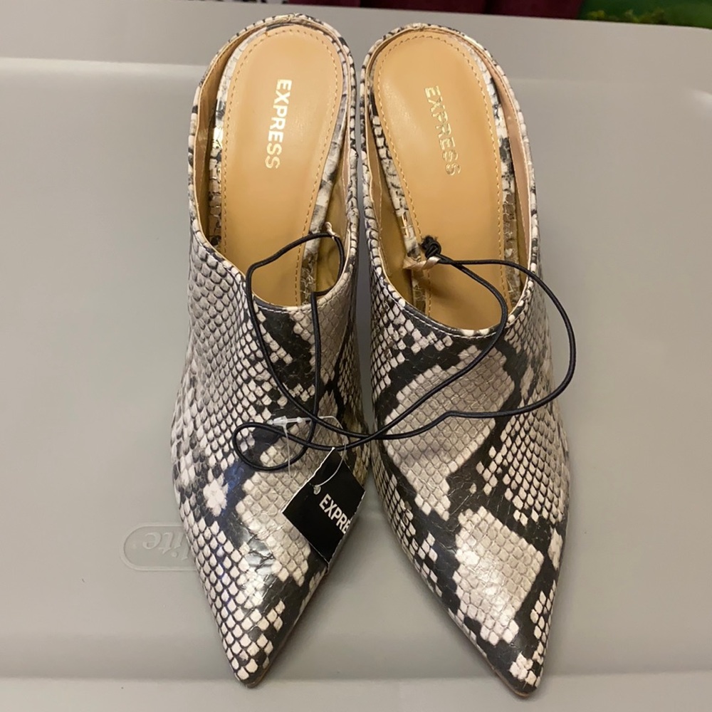 Express multi colored half silhouette heels boots.